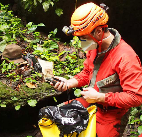 Speleologist Olivier Testa preparing for cave surveying