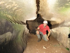 Speleologist Olivier Testa in a round shaped gallery 
